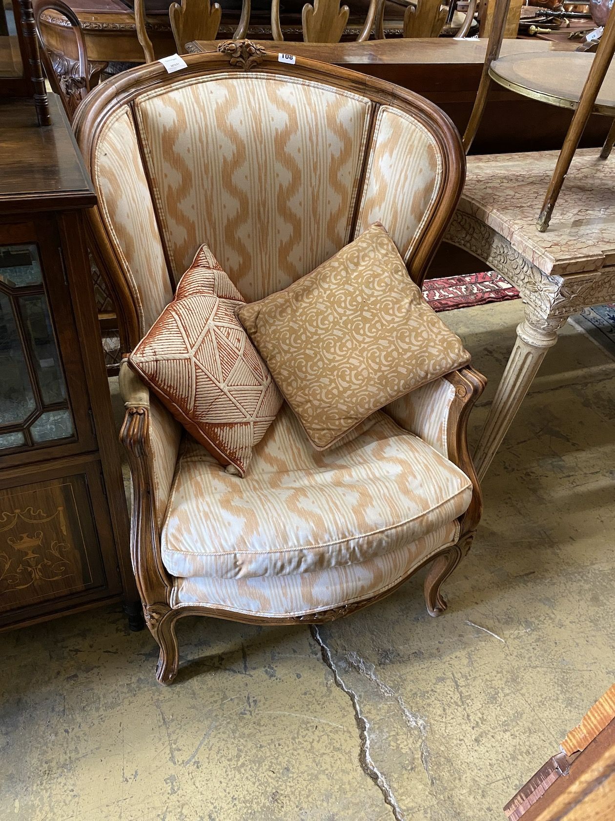 A Louis XV style walnut framed fauteuil, width 63cm, depth 50cm, height 103cm